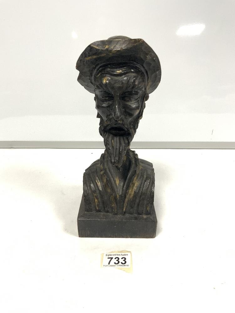 Wooden man carved with hat and beard