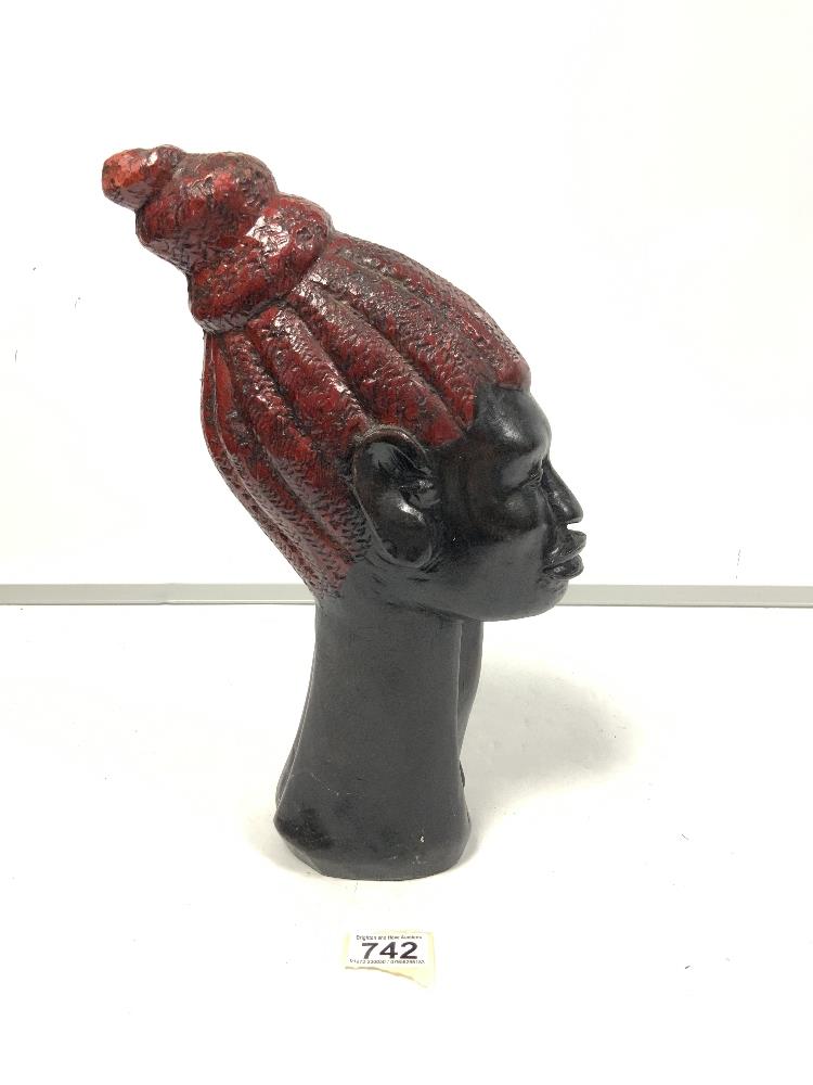 Carved african wooden bust with painted hair