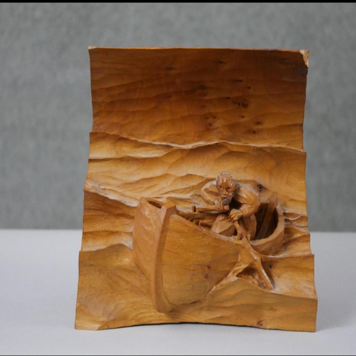 Man in a boat, vintage carved pine wood relief