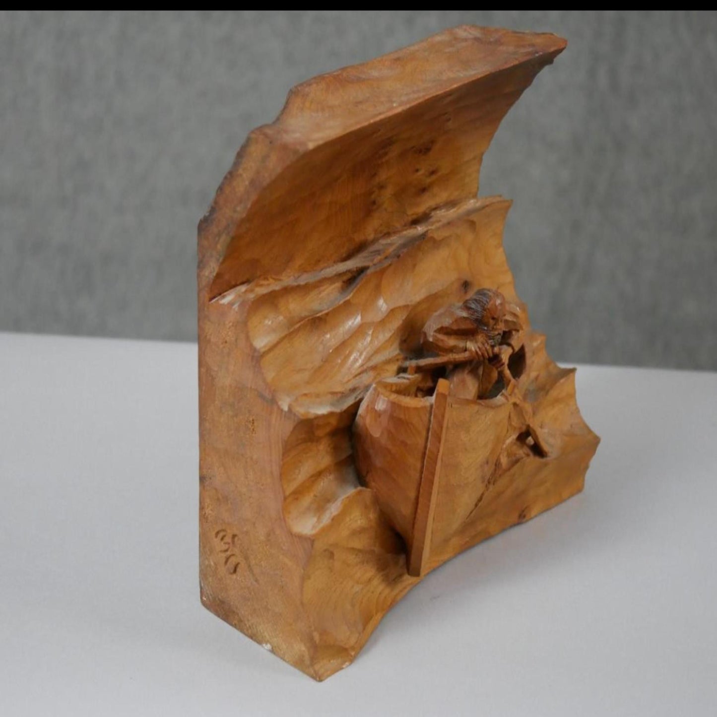 Man in a boat, vintage carved pine wood relief