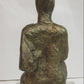 Seated woman on a perspex plinth