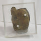 Seated woman on a perspex plinth