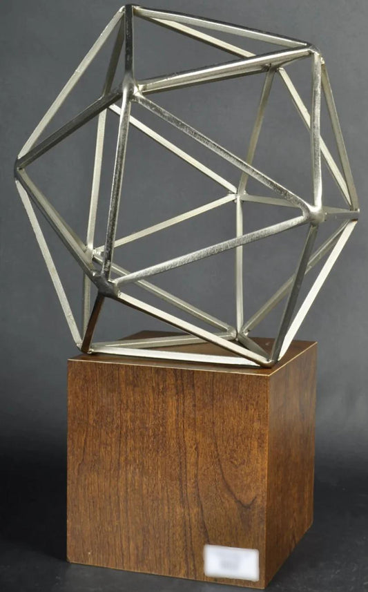 Metal sculpture on wood stand