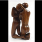 Wood carving of an embracing couple