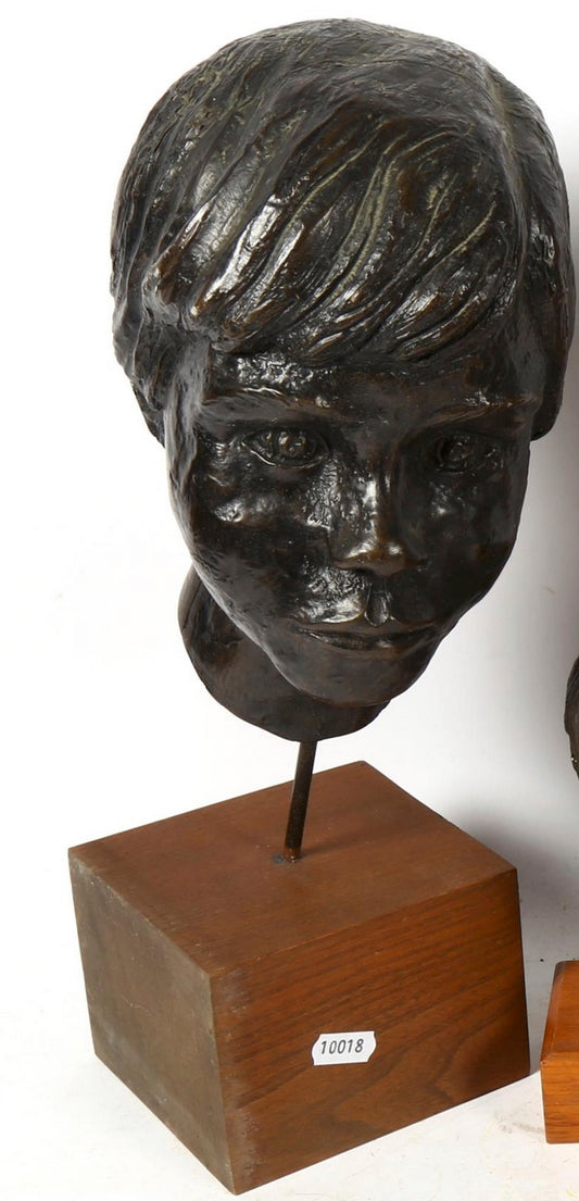 Sculptured head mounted on wooden plinth