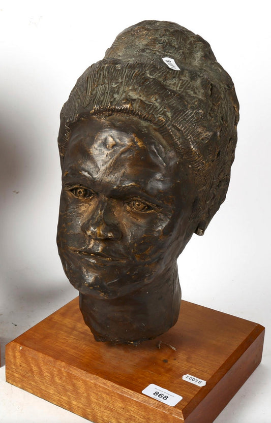 Bronze head mounted on wooden plinth