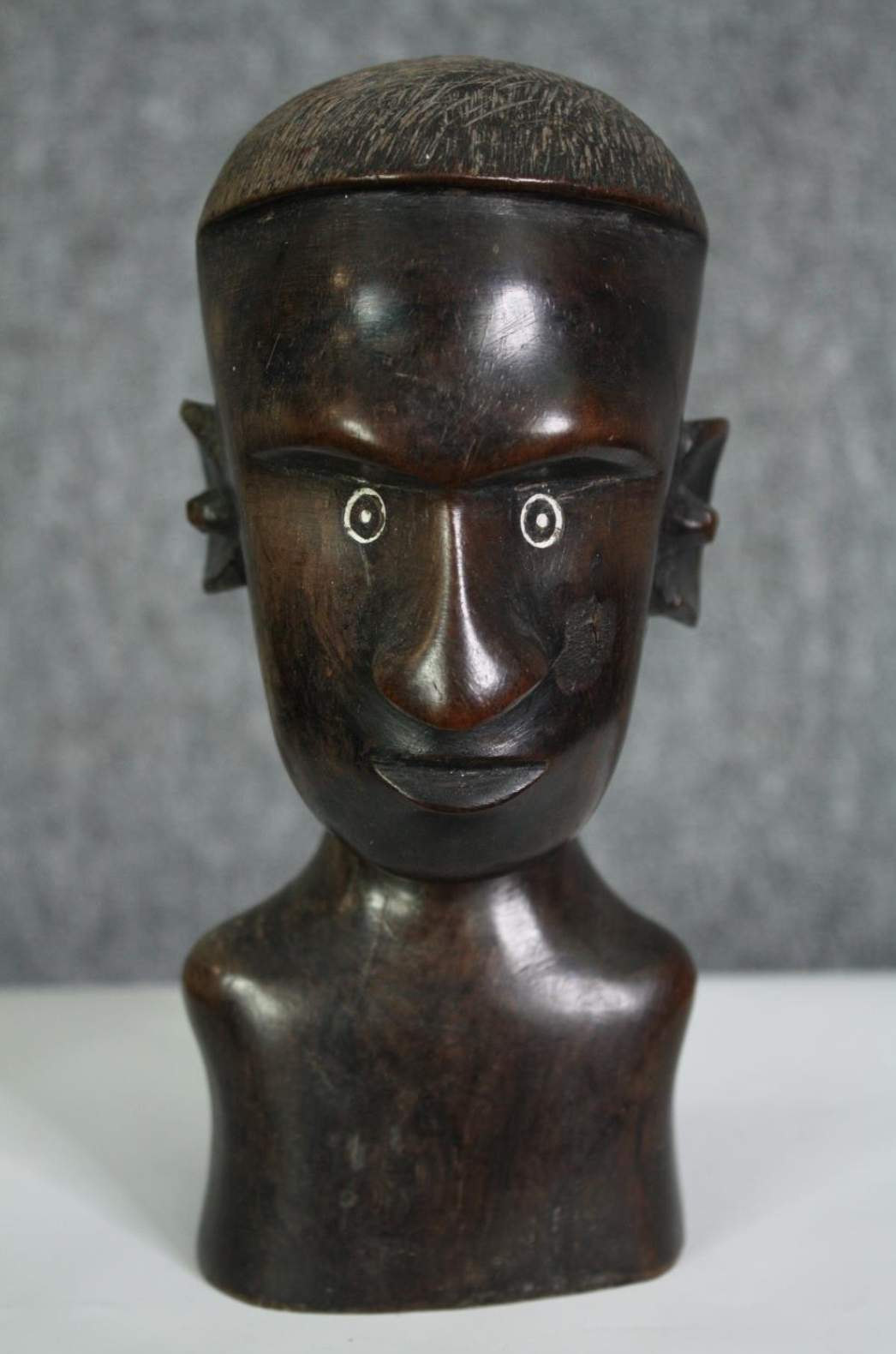 A carved African hardwood bust