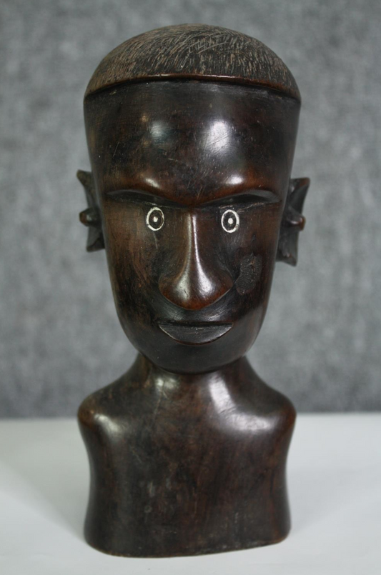 A carved African hardwood bust