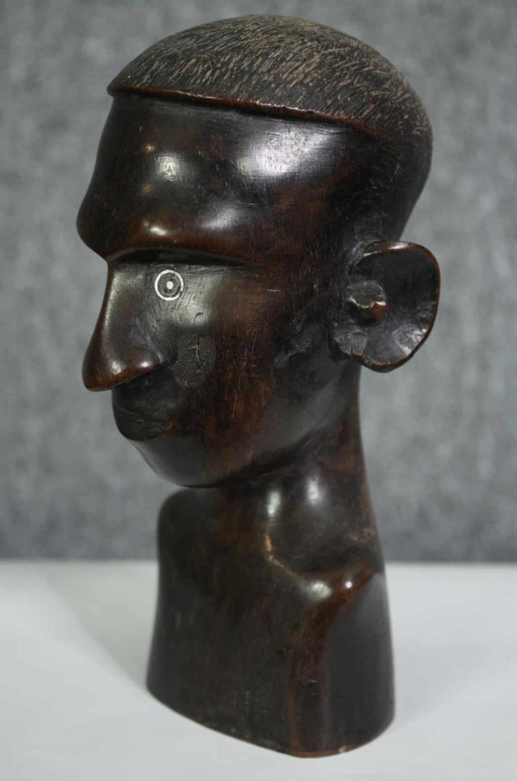 A carved African hardwood bust