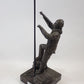 A bronze workman figure with ladder