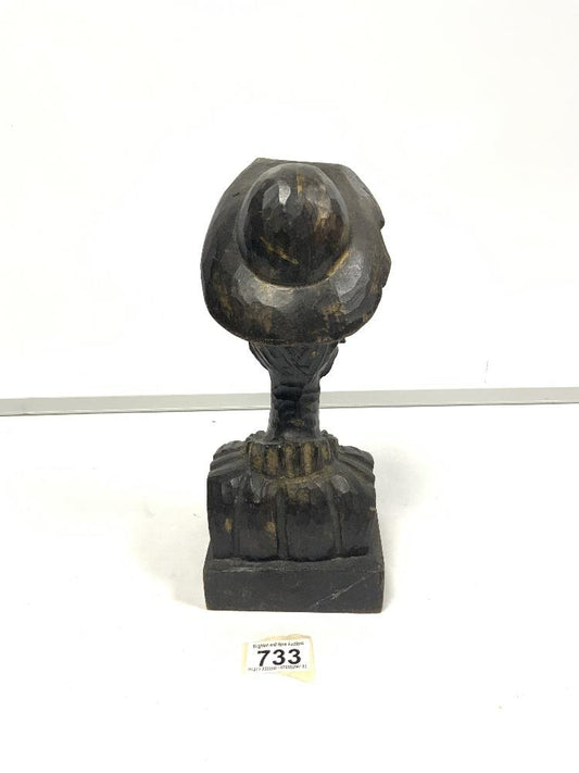 Wooden man carved with hat and beard