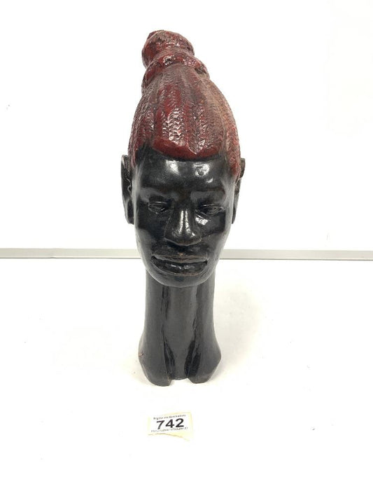 Carved african wooden bust with painted hair