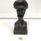 Wooden man carved with hat and beard
