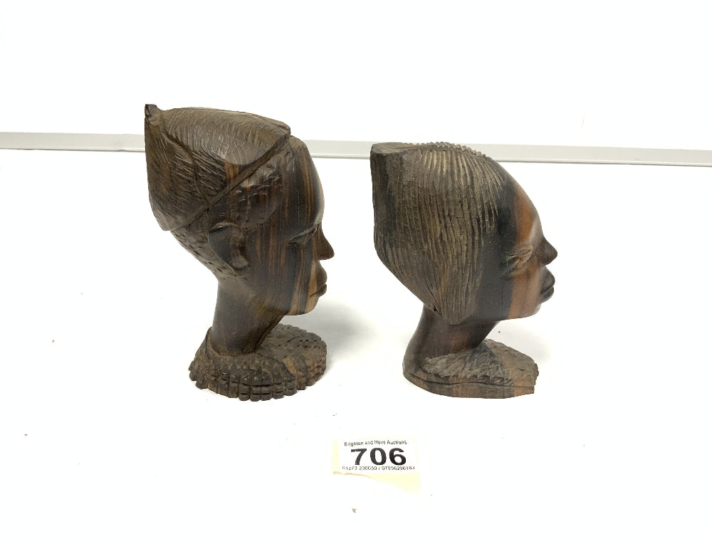 Two wooden bust carvings of women