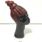 Carved african wooden bust with painted hair